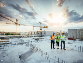Group of construction workers on a roof top 