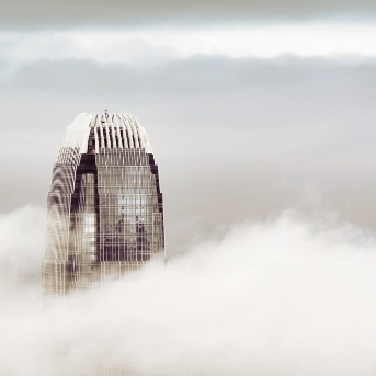 Skyscrapper building peaking through the clouds