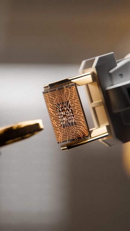 Robotic arm engraving a computer chip