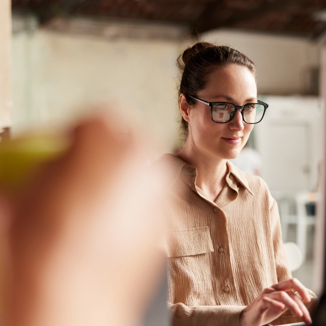 Woman wearing glasses at computer