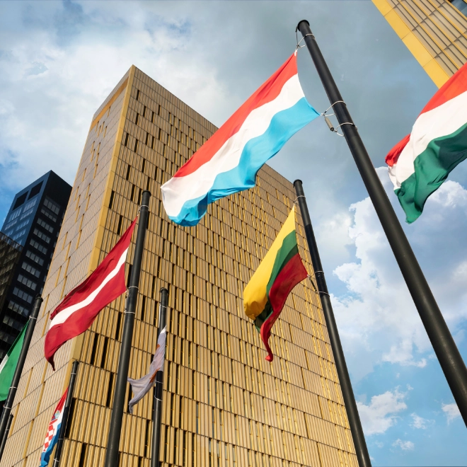European Flags flapping in the wind, in front of European Union Court of Justice building in Luxembourg Ki