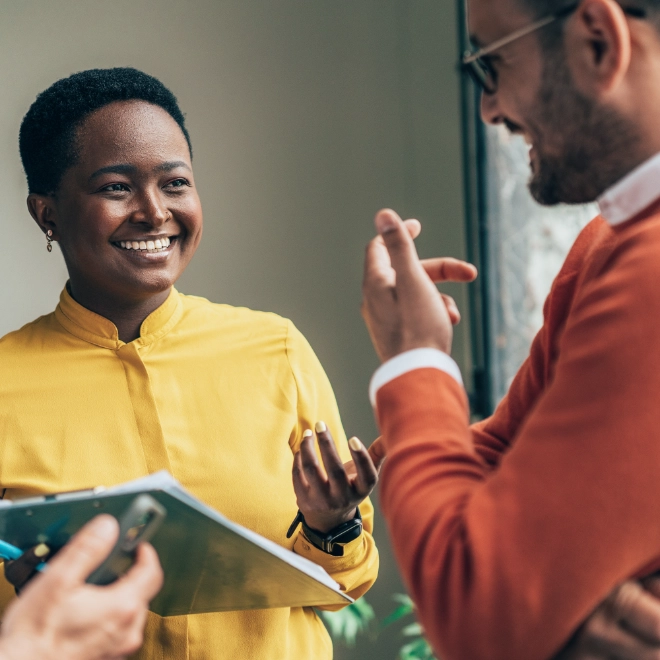Woman and two men talking